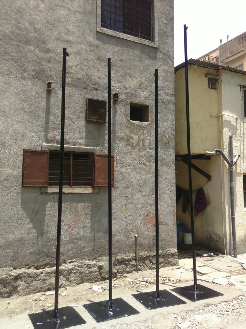 flag poles fabricated out of iron pipes