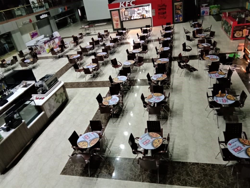 advertising on tables in a Pizza Hut restaurant using UV printed cast vinyl