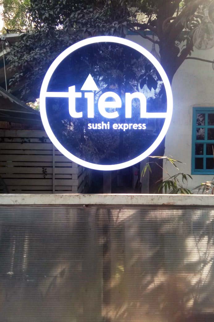 3D acrylic glow sign board cut in the shape of a logo with LEDs embedded within