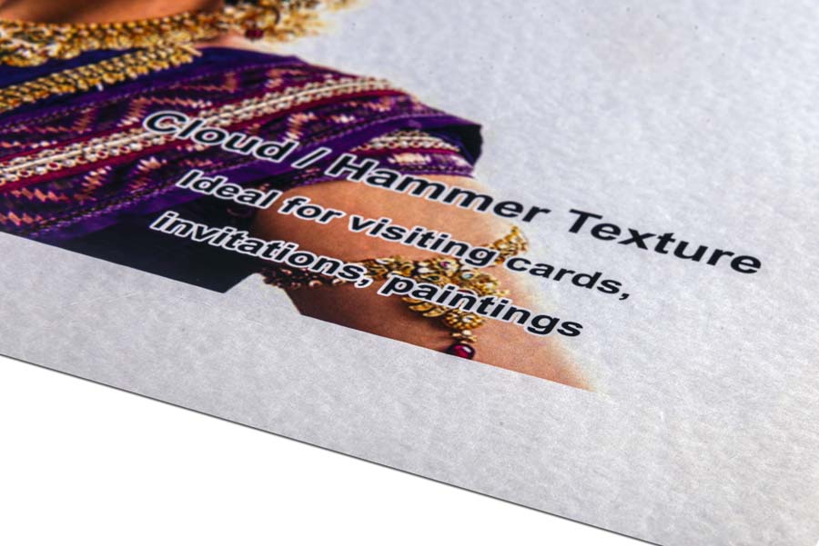 Photo print on a paper with a cloudlike texture. This texture is also called hammer finish because it looks like the paper is pitted with a spherical hammer