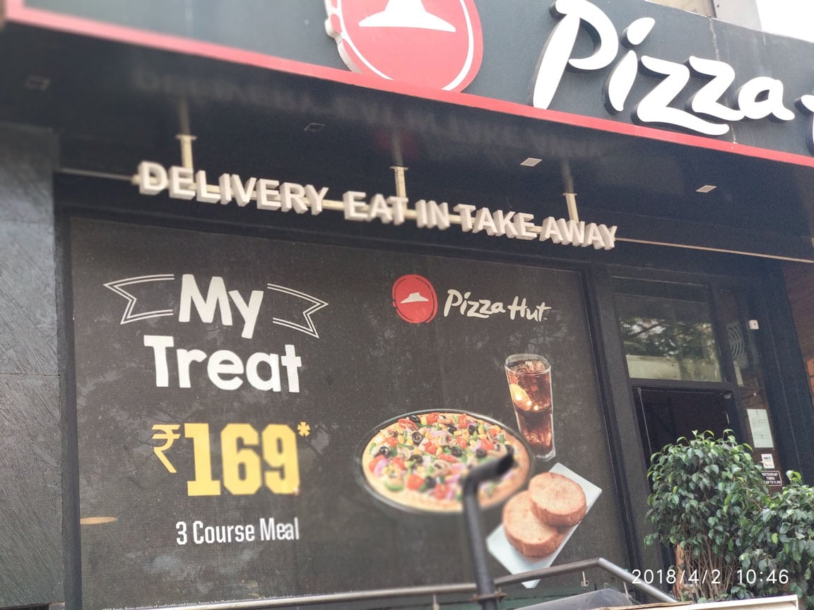 one way vision mesh film used for branding glass panels in a restaurant
