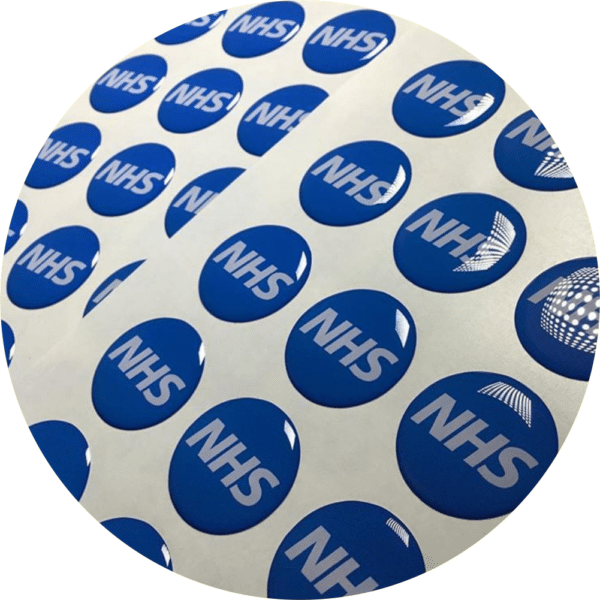 blue circular domed labels having a raised effect make for premium quality logo stickers