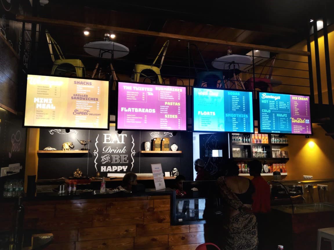 four LED clip on frames lit from within showing the food menus in a cafe
